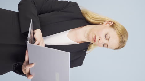 Vertical-video-of-Tired-business-woman-falling-asleep-at-laptop.